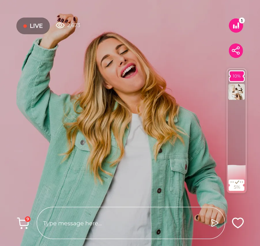 Young woman with long blonde hair dancing and smiling during a live streaming session on a pink background.
